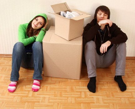 Local van removal team handling boxes and furniture in Highgate