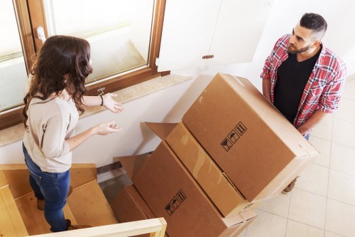 Local office moving team handling furniture in Highgate